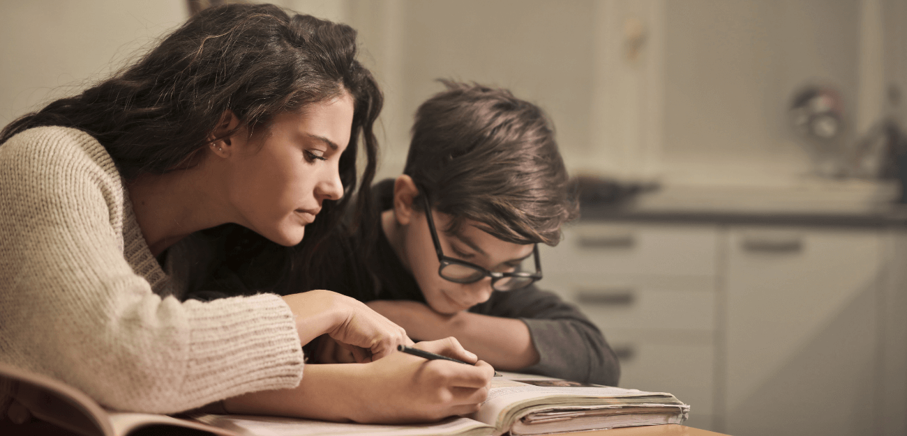 mom teaching a boy