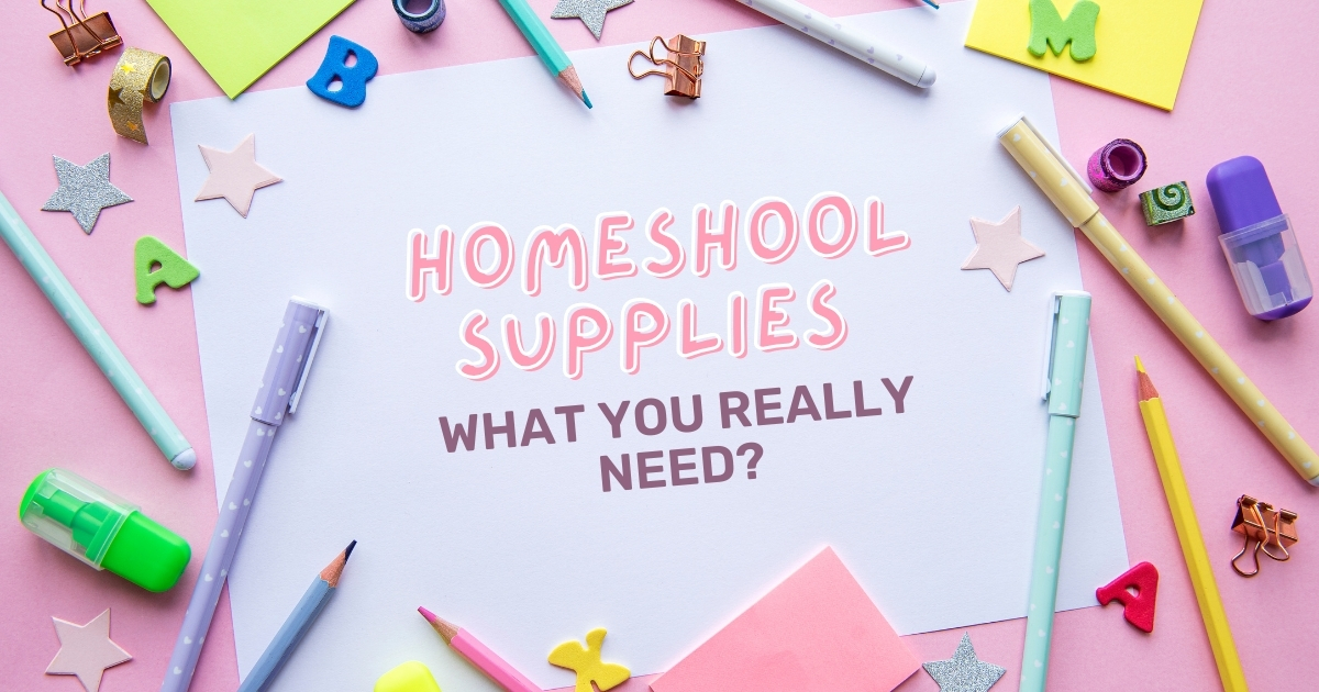 Flat lay of colorful homeschool supplies, including pens, pencils, paper clips, and decorative items, arranged around a white sheet of paper with the text 'Homeschool Supplies: What You Really Need?' in pink and bold lettering on a pink background.