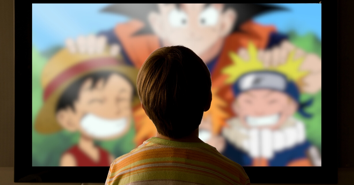 Child watching an animated foreign language show on TV, using cartoons as a fun and immersive way to learn a new language. The image represents language acquisition through media and interactive learning.