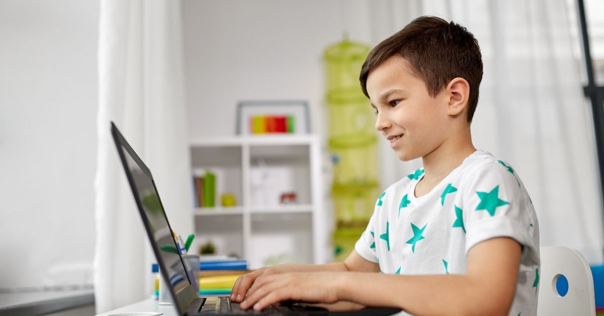 Child using an online homeschool program for interactive learning at home.