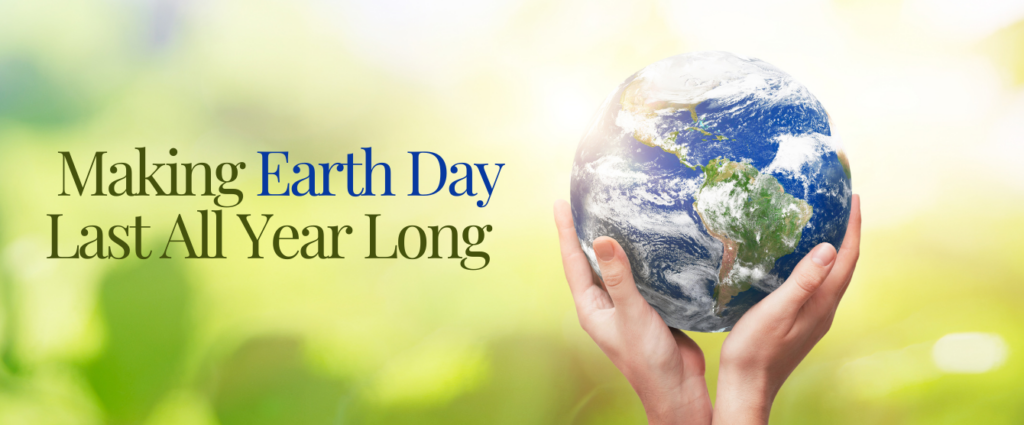 A pair of hands holding the earth.