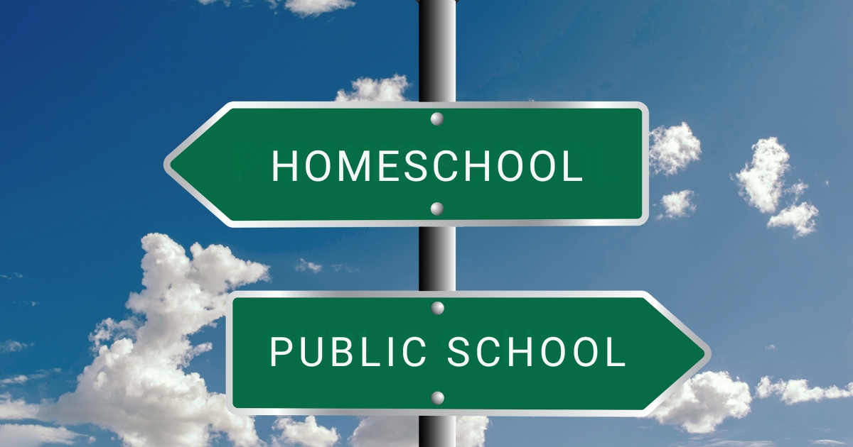Two green directional road signs pointing to “Homeschool” and “Public School” against a blue sky background, symbolizing the decision to transition from traditional schooling to homeschooling.